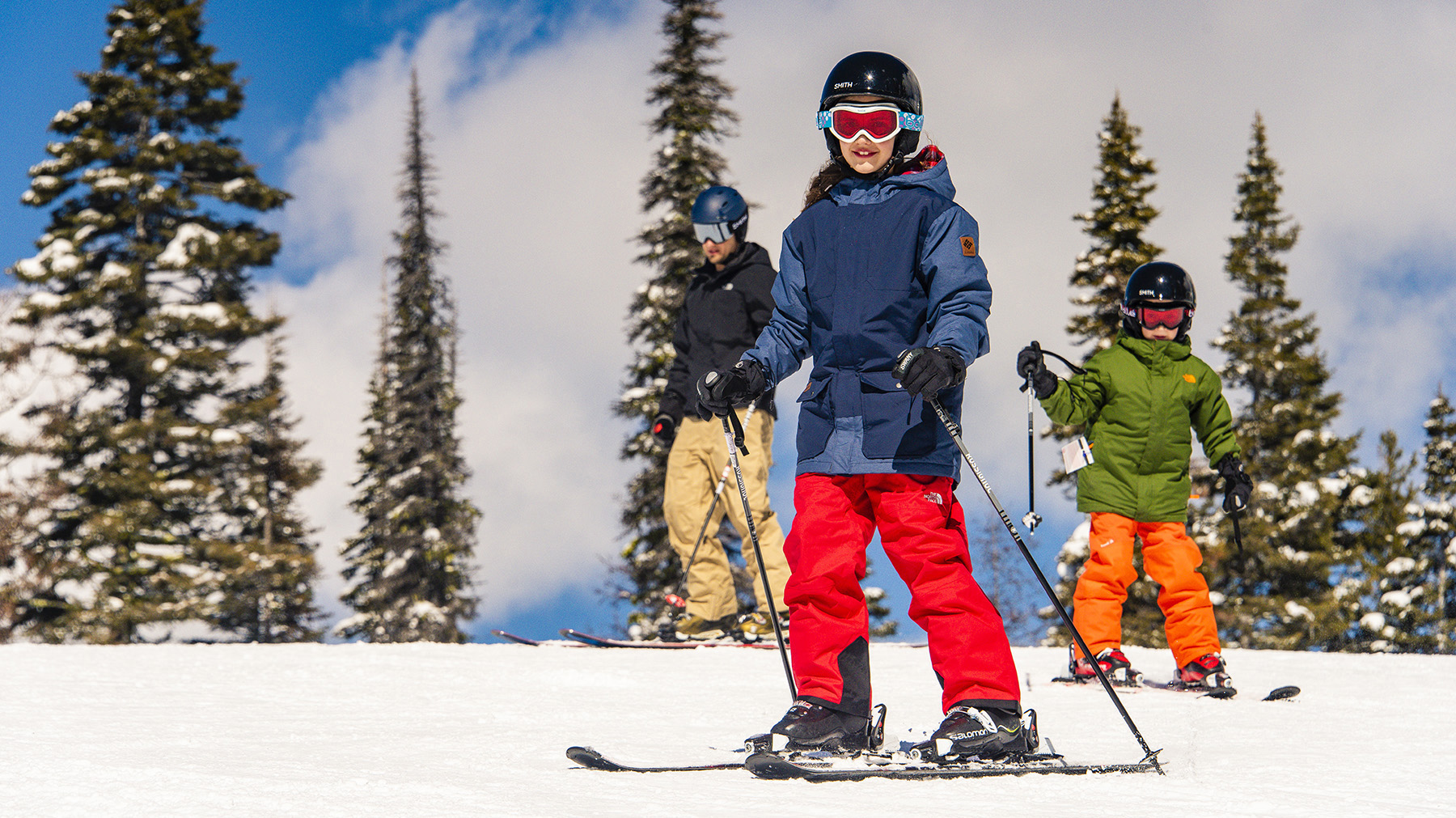 Young girl skiing at Brundage Mt. Resort with skiers in the background