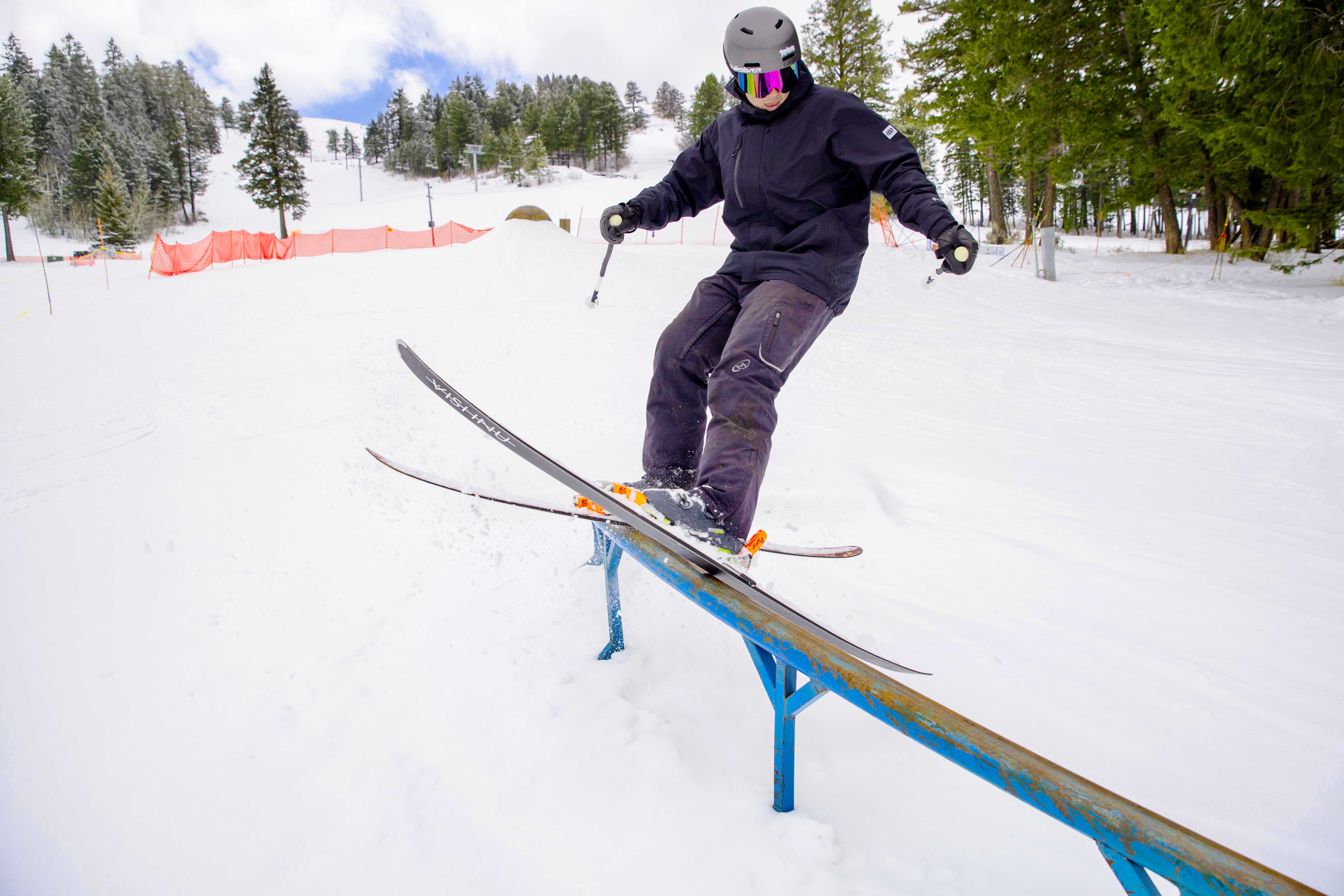A skier jibs a rail at Kelly Canyon. 